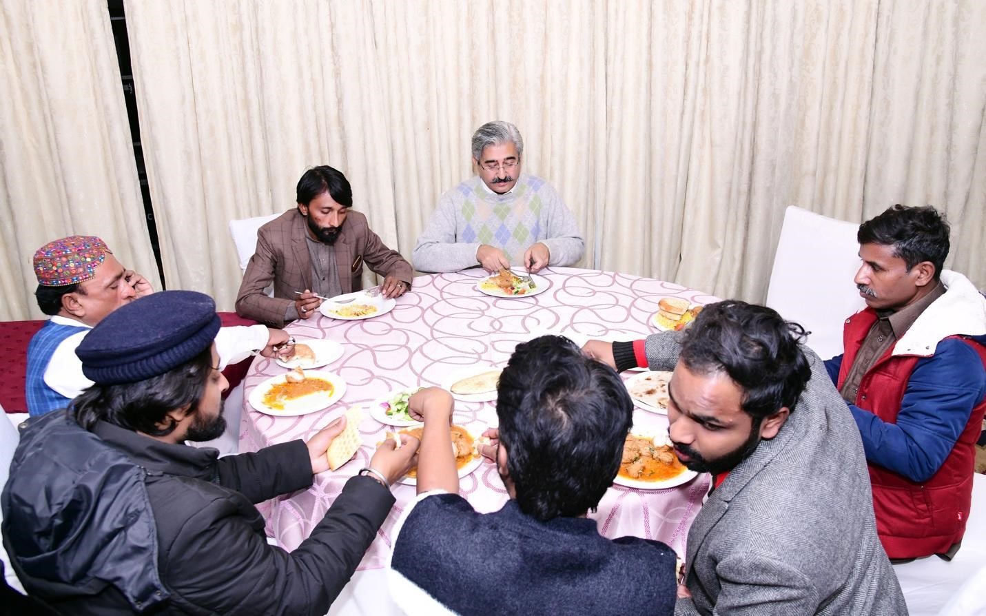 Breaking taboos over meals- dignitaries having lunch with sanitation workers. Image: Center for Law & Justice